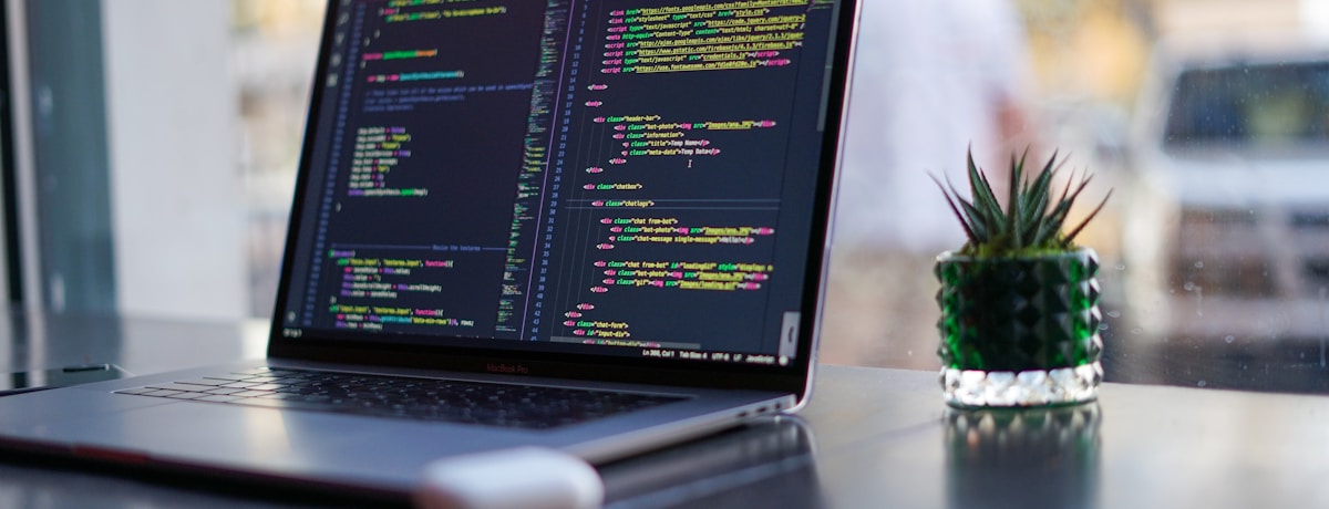 Developer at work on a modern laptop setup